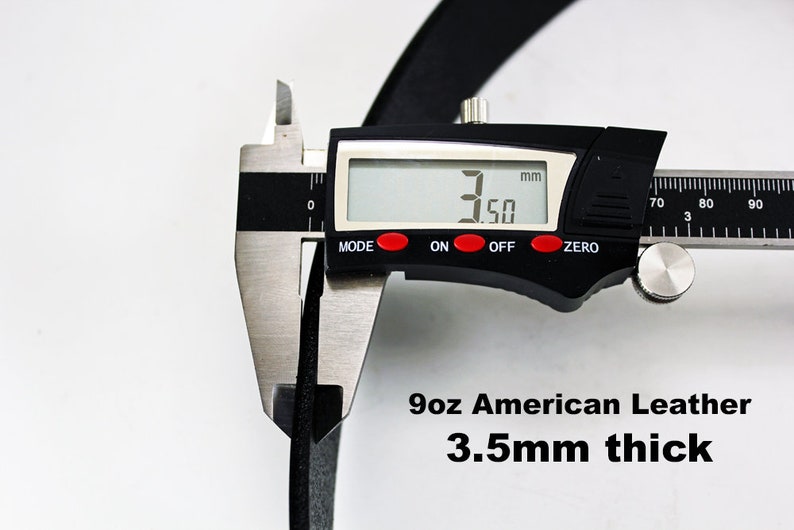 May include: Close-up of a black leather strap being measured with a digital caliper. The caliper reads 3.50 mm. The text below reads "9oz American Leather 3.5mm thick".