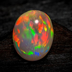 4.70 Crt Natural Ethiopian Opal Cabochon: Rainbow Fire Oval Gemstone (11x14 MM)