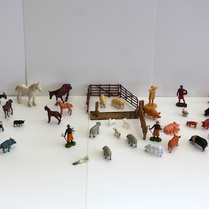 Britains Farm Animals & other makes, total of 28, with 4 people and a Scarecrow.
