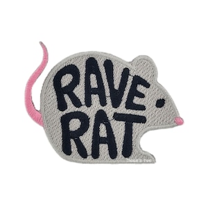 May include: Embroidered patch in the shape of a mouse with the words "RAVE RAT" in black block letters. The mouse is gray with a pink tail and nose. The patch is on a white background.