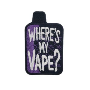 May include: Embroidered patch in a rectangular shape with a rounded top. The patch is black with the text "WHERE'S MY VAPE?" in white and purple. The background has a geometric design.