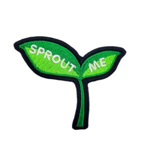 May include: Embroidered patch featuring a green sprout design with the words "SPROUT ME" in white. The patch has a black border and a stem. The leaves are a bright green color.