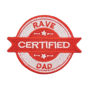 May include: A circular, red and white embroidered patch with the text "RAVE CERTIFIED DAD". The patch features a banner design with the word "CERTIFIED" in white. A fun accessory for clothing or bags.