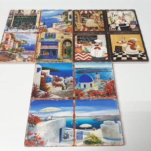 May include: Set of nine ceramic coasters featuring colorful images of Greek architecture, food, and people. The coasters have a rustic, distressed look and are perfect for adding a touch of Mediterranean charm to your home.