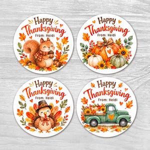 May include: Four circular stickers with a white background and the text Happy Thanksgiving From: Heidi. The designs feature a squirrel with an acorn, pumpkins with sunflowers, a turkey wearing a hat, and a green truck carrying pumpkins.