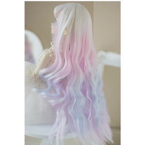 May include: A long, wavy doll wig with a gradient of white, pink, and blue colors. The wig is styled with loose curls and is suitable for a doll with a 1/3 or 1/4 scale.