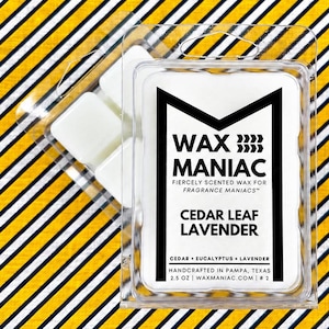 May include: A clear plastic clamshell package containing white wax melts. The label features the text WAX MANIAC, FIERCELY SCENTED WAX FOR FRAGRANCE MANIACS, CEDAR LEAF LAVENDER, CEDAR EUCALYPTUS LAVENDER, HANDCRAFTED IN PAMPA, TEXAS, 2.5 OZ, WAXMANIAC.COM, # 2.