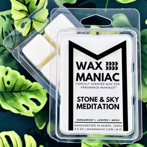 May include: A clear plastic clamshell container holding white wax melts. The label reads WAX MANIAC, FIERCELY SCENTED WAX FOR FRAGRANCE MANIACS, STONE & SKY MEDITATION, BERGAMONT + JUNIPER + MOSS, HANDCRAFTED IN PAMPA, TEXAS, 2.5 OZ | WAXMANIAC.COM | # 31.