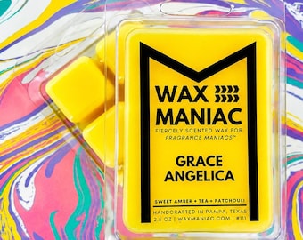 May include: A bright yellow wax melt clamshell package labeled Wax Maniac Grace Angelica with text reading Fiercely Scented Wax For Fragrance Maniacs, Sweet Amber, Tea, Patchouli, Handcrafted In Pampa, Texas, and 2.5 oz, featuring a black logo and text.