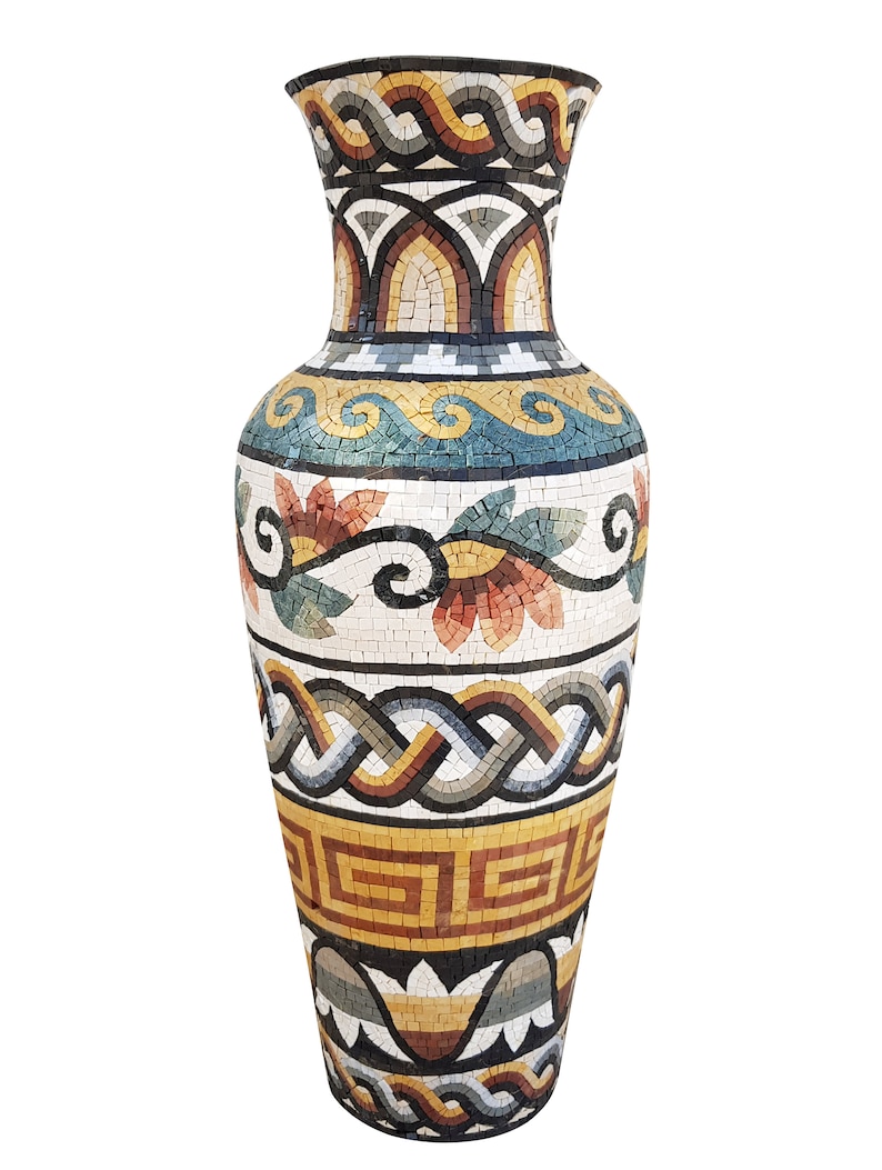 May include: A large, decorative vase with a mosaic design. The vase is made of small, colorful tiles and features a variety of geometric and floral patterns. The vase is white with accents of blue, green, yellow, orange, and brown.