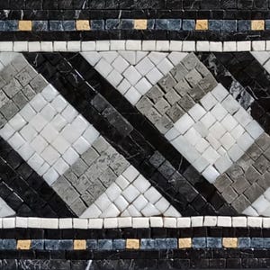 May include: A mosaic tile border with a repeating geometric pattern. The design features diagonal stripes in black, white, and gray, with accents of gold and blue. The mosaic is made of small, square tiles.