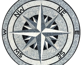 May include: A black and white mosaic compass rose with the cardinal directions N, S, E, and W, and the intermediate directions NE, NW, SE, and SW.