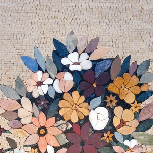 May include: A mosaic artwork depicting a bouquet of colorful flowers in a vase. The flowers are made of various colored stones and include white, pink, red, yellow, and orange flowers. The background is a light beige mosaic.