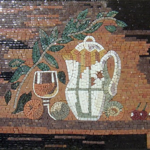 May include: A mosaic art piece depicting a still life with a white pitcher, a glass of wine, fruit, and a leafy branch. The background is a brown and black mosaic.
