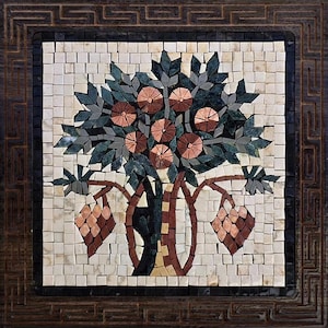 May include: Square mosaic art piece featuring a tree with pink flowers, green leaves, and brown branches. The mosaic is set against a white background with a dark brown border and a decorative wooden frame.