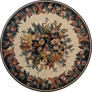 May include: A round mosaic tile featuring a floral design. The centre of the tile depicts a bouquet of flowers and fruit in shades of brown, yellow, and red. The outer border of the tile is a repeating pattern of leaves and flowers in shades of green, brown, and black.