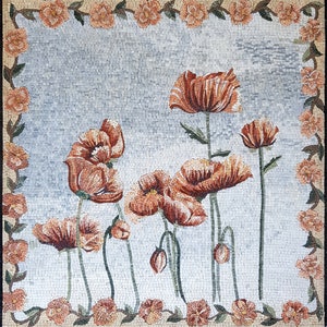 May include: A mosaic artwork featuring a floral design with orange poppies on a light blue background. The poppies are arranged in a cluster with stems and leaves extending from the center. The artwork is framed with a border of small orange flowers and leaves.
