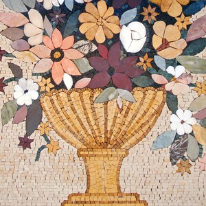 May include: A mosaic tile artwork depicting a vase filled with colorful flowers. The vase is made of small, golden tiles and has a scalloped rim. The flowers are made of various colored tiles, including pink, white, red, and green.
