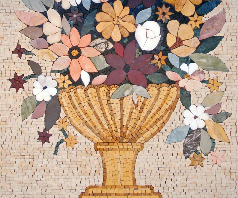 May include: A mosaic tile artwork depicting a vase filled with colorful flowers. The vase is made of small, golden tiles and has a scalloped rim. The flowers are made of various colored tiles, including pink, white, red, and green.