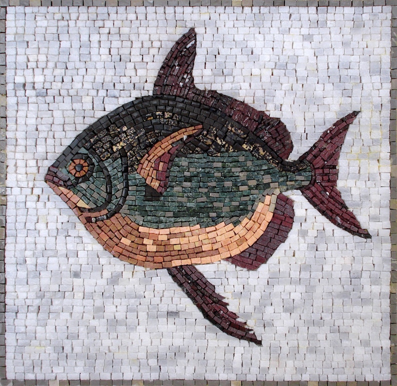 May include: A mosaic artwork depicting a fish. The fish is composed of small, square tiles in shades of brown, green, black, and red. The background is a light gray, tiled surface. The fish has a rounded body and prominent fins.
