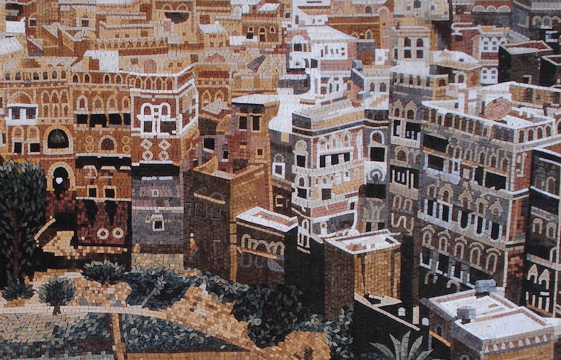 May include: A mosaic artwork depicting a cityscape with multiple buildings in a Middle Eastern style. The buildings are made of small, colourful tiles and have intricate details. The artwork is set against a background of a clear blue sky.