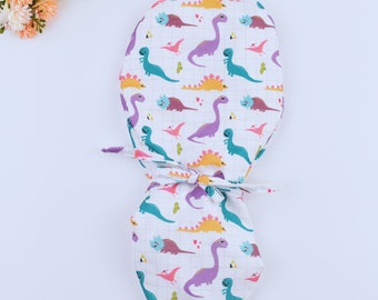 Dinosaur Ponytail scrub cap, Surgical cap women. Satin Lined Option Surgical cap with ponytail. Satin Lined Scrub cap.