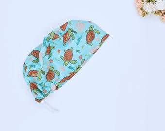 Ocean Blue Turtle Ponytail scrub caps for women, Surgical cap. Satin Lined Option Surgical cap with ponytail. Sea Beauty Euro scrub caps.