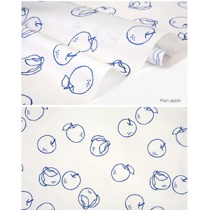 May include: White fabric with a blue apple pattern. The apples are outlined in blue and have a dotted texture. The text "Plain apple" is printed in the bottom right corner.
