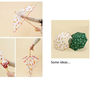 May include: Four different views of umbrellas with a dog print design. The umbrellas are white with red trim and feature a yellow dog print. One umbrella is green with a white dog print. The umbrellas are closed and open.