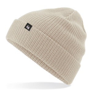 Beige sand colour organic cotton beanie hat with black fabric tag stitched to the cuff