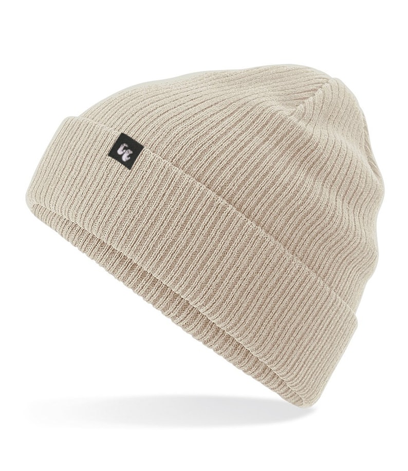 Beige sand colour organic cotton beanie hat with black fabric tag stitched to the cuff