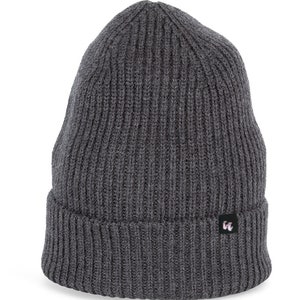 A dark heather grey beanie with chunky, fisherman-style ribbed knit. It has a black fabric label with a white logo stitched to the cuff