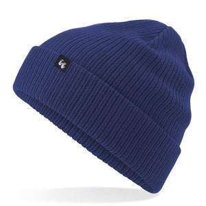 Navy blue organic cotton beanie hat with black fabric tag stitched to the cuff