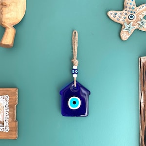 Colgante de pared de mal de ojo: dije de Nazar de vidrio azul con forma de casa