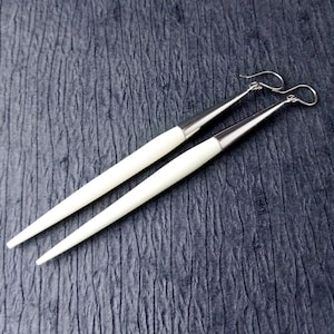 Spear-shape bone silver plated earrings| White