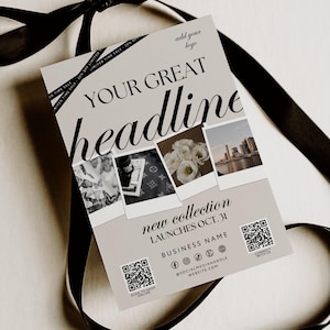 Può includere: Un biglietto promozionale con il testo "YOUR GREAT headline" e "new collection LAUNCHES OCT. 31" è legato con un nastro nero. Il biglietto presenta quattro piccole immagini e codici QR. Vengono visualizzati anche il nome dell'azienda e i social media.