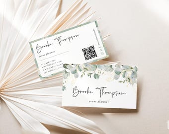 May include: Two rectangular business cards featuring a white background with green eucalyptus leaf illustrations. The cards display the name Brooke Thompson, the title event planner, contact details, and a QR code in black text.