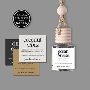 May include: A glass oil diffuser bottle with a light wood cap and hanging cord, featuring a white label reading ocean breeze. Three square labels are displayed nearby with text including coconut vibes and your brand name.