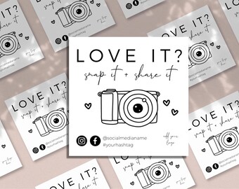 May include: A square white card featuring the black text LOVE IT? snap it + share it above a line drawing of a camera. The card includes icons for Instagram and Facebook, placeholders for social media handles, a hashtag, and a logo.