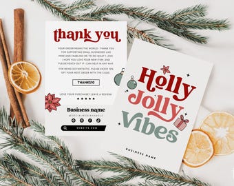 May include: Two white rectangular cards with holiday-themed graphics. One card features the red text thank you, a discount code box labeled THANKS10, and social media icons. The other card displays the red and green text Holly Jolly Vibes.