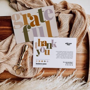 May include: Two rectangular cards with the text grateful and thank you in multi-colored typography. A gold wax seal stamp and three circular wax seals are placed next to the cards. The cards feature placeholders for a logo and social media.