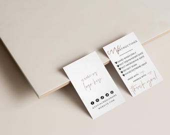 May include: Two white rectangular cards with black text. One card reads name or logo here and includes social media icons. The other card lists care instructions including hand wash only, not dishwasher safe, not microwave safe, do not soak, and avoid extreme heat.