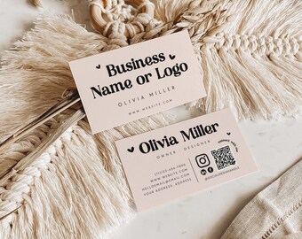 May include: Two rectangular business cards in a light beige colour with black text. The top card displays Business Name or Logo, Olivia Miller, and a website. The bottom card shows Olivia Miller, Owner Designer, contact details, and a QR code.