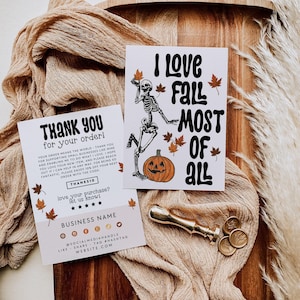 May include: Two rectangular cards with autumn themes. One card features a skeleton, a jack-o'-lantern, and the text I LOVE FALL MOST OF ALL. The second card is a thank you note with space for business details and social media icons.