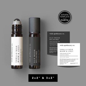 May include: Two essential oil roll-on bottles and two product labels on a grey background. One bottle has a white label with "Vanilla Noir Warm & Cozy" text. The other bottle has a black label with "Silk Moon Relaxing" text. The labels are 5.08cm x 5.08cm and 7.62cm x 5.08cm.
