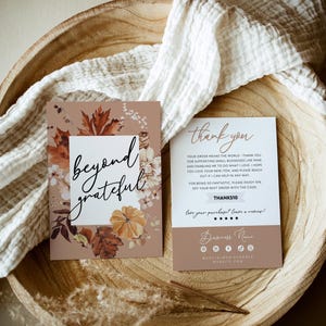 May include: Two rectangular thank you cards with autumn-themed graphics. One card features the text beyond grateful surrounded by fall leaves and a pumpkin. The other card includes thank you text, a discount code, and social media icons.