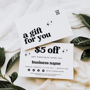 May include: Two white gift cards with black text. The top card reads "a gift for you" and the bottom card says "£5 off" with the text "any purchase over £30" and "business name". The cards have star accents.