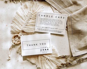 May include: A cream-colored macrame feather wall hanging with a wooden ring, accompanied by two white rectangular cards. One card reads CANDLE CARE with instructions, and the other reads THANK YOU with social media icons and website text.