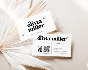 May include: Two white rectangular business cards featuring the black text olivia miller in a stylised font. The cards include star icons, a QR code, social media icons, and placeholder contact information such as phone, website, and email.