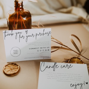 May include: Two white rectangular cards with black text. One card reads Thank you for your purchase with a logo placeholder. The other card reads Candle care with instructions to trim the wick to 1/4 inch and burn for 2 hours. Both cards feature black script.